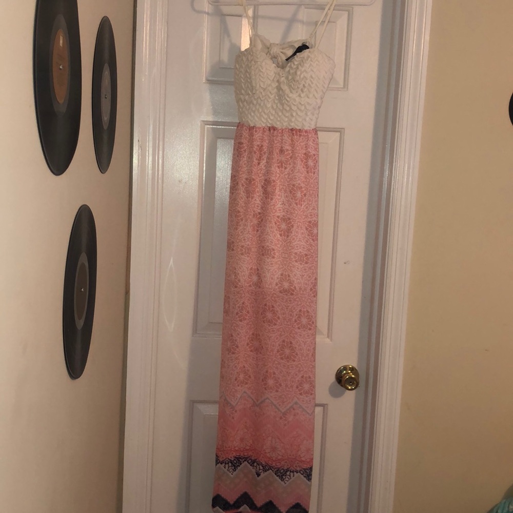 A long pink and white dress with subtle blue